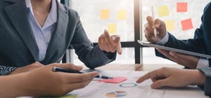teamwork-with-business-people-analysis-cost-graph-2022-10-03-22-26-39-utc-1